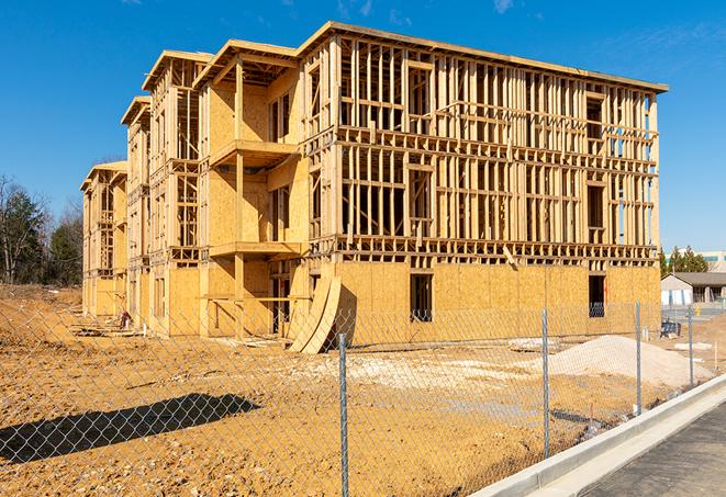 a job site enclosed by temporary chain link fences, ensuring safety for workers and pedestrians in Lennox, CA